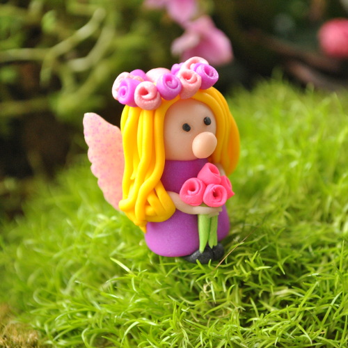 fairy bella holding roses